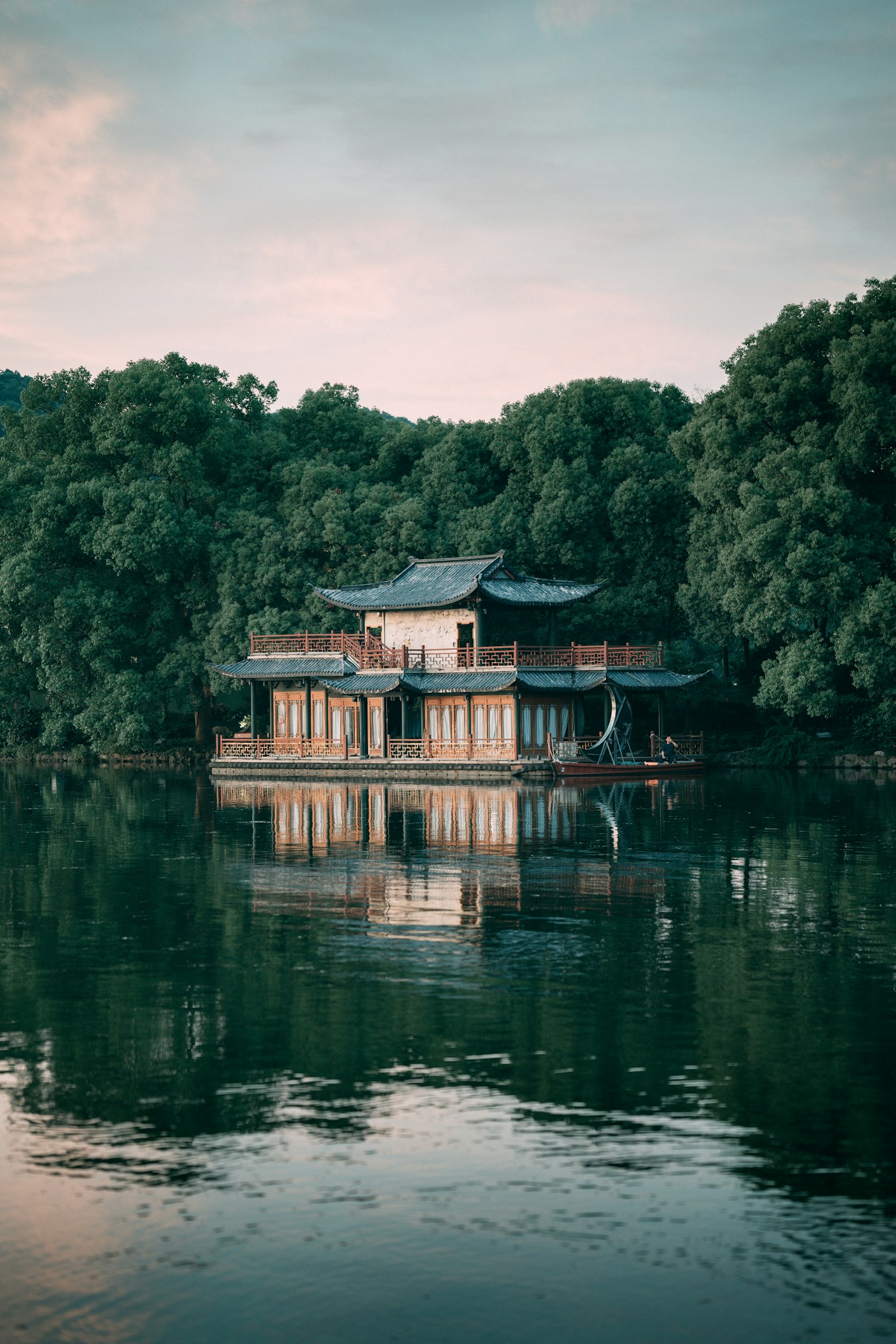 A traditional boat on the tranquil waters of Hangzhou